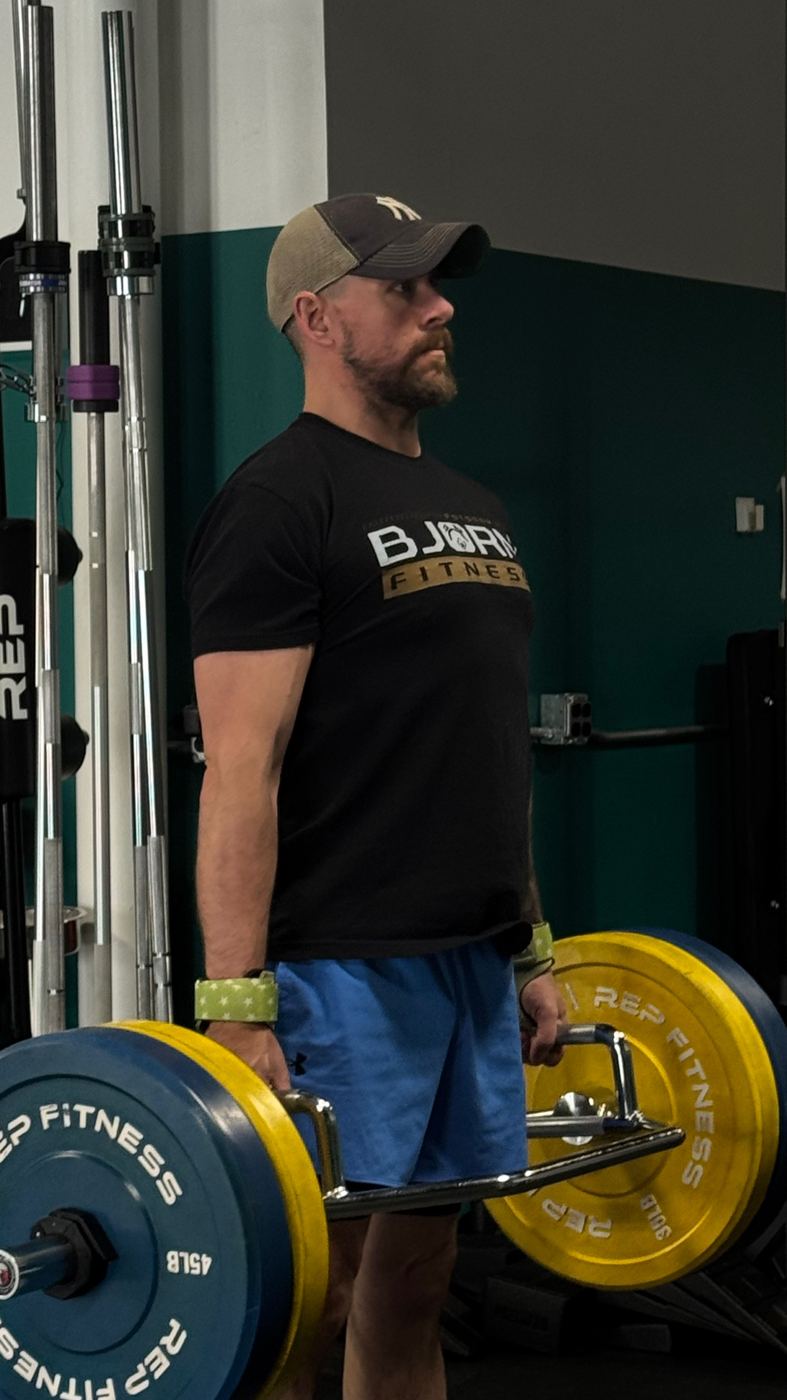 Adventurer lifting a loaded trap bar at Bjorn Fitness